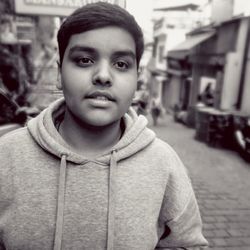 Portrait of boy standing on street