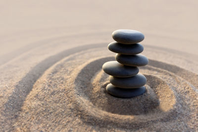 Stack of stones on sand