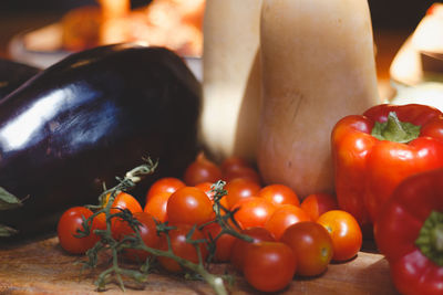 Close-up of tomatoes and fruits on table