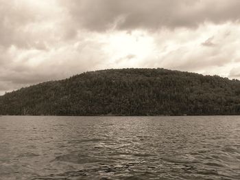 Scenic view of sea against cloudy sky