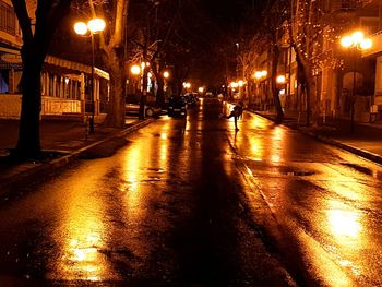 Illuminated street at night during winter