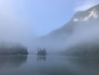 Scenic view of lake in foggy weather