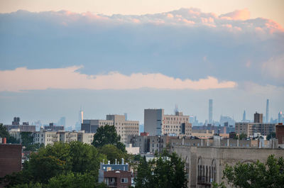 Buildings in city against sky