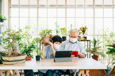 People sitting on table at home