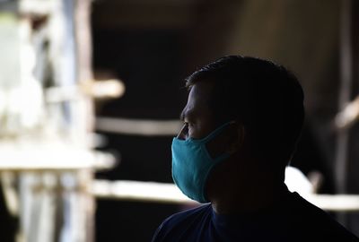 Close-up portrait of man with face mask