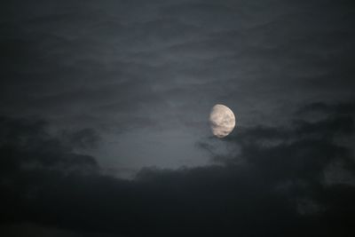 Low angle view of moon in sky at night