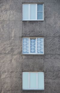 Low angle view of window on wall of building