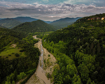 High angle view of trees and mountains against sky