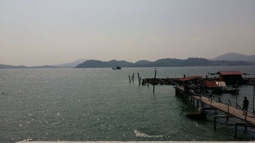 Boats moored at harbor