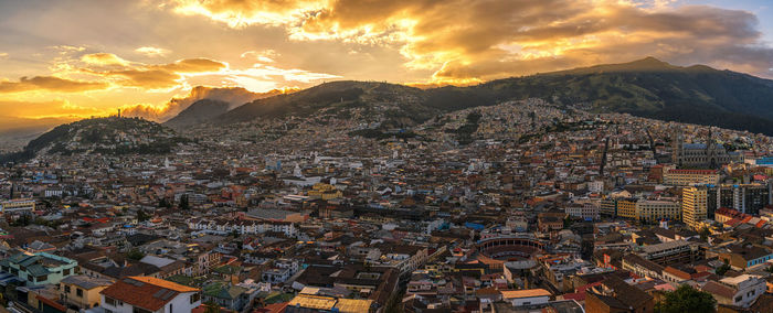 Panoramic view of cityscape against sky during sunset