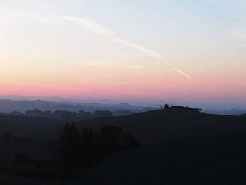 Scenic view of silhouette landscape against sky during sunset