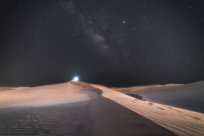 Scenic view of sea against sky at night