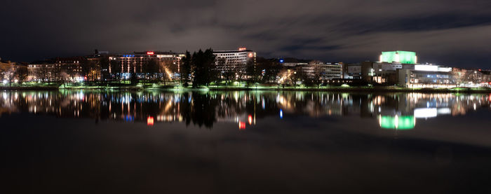 Reflection of illuminated buildings in water at night