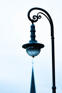 Low angle view of street light against sky
