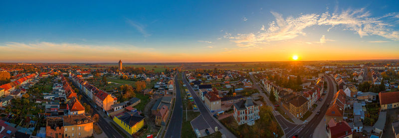 High angle view of city against sky during sunset