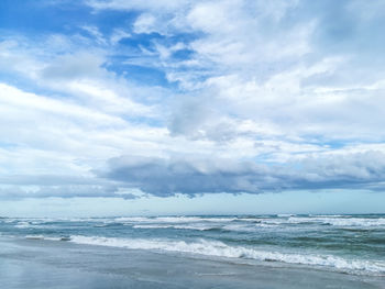 Scenic view of beach against sky