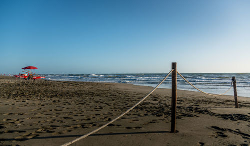 Scenic view of beach against clear sky