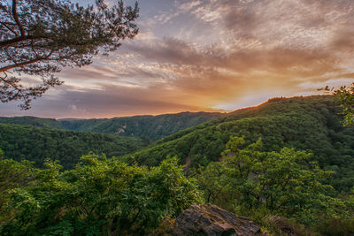 Scenic view of mountains against sky during sunset