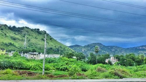 Scenic view of mountains against cloudy sky