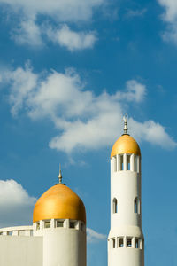 View of church and building against sky