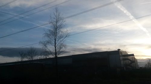 Low angle view of built structure against cloudy sky