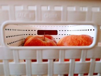 Close-up of orange slice in basket