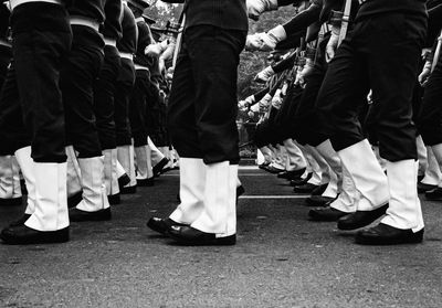 Low section of people standing on street