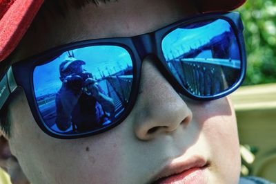 Close-up portrait of man wearing sunglasses