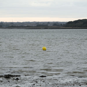 View of ball in sea against sky