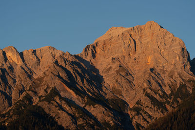 Low angle view of rock formation against clear sky