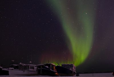 Scenic view of aurora borealis against sky at night