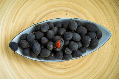 High angle view of blueberries in bowl on table