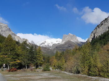 Scenic view of snowcapped mountains against sky