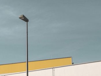 Low angle view of street light against sky