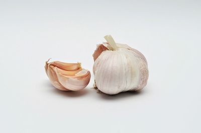 Close-up of garlic against white background