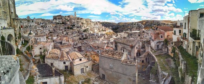 Panoramic shot of cityscape against sky