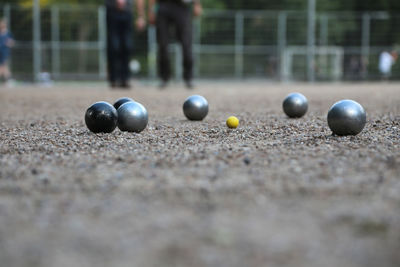 2006 - petanque ball boules and small yellow jack on petanque field,