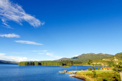 Scenic view of embalse del neusa against blue sky