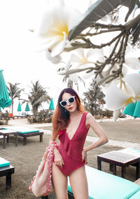 Portrait of young woman wearing sunglasses