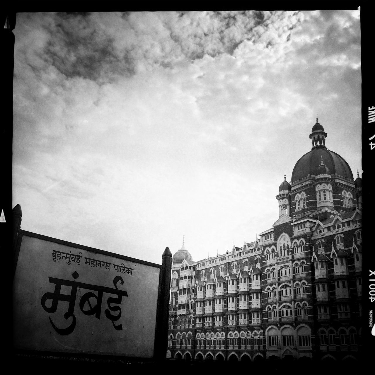 architecture, building exterior, built structure, text, sky, low angle view, western script, communication, cloud - sky, religion, transfer print, place of worship, cloudy, auto post production filter, spirituality, church, non-western script, day, cloud