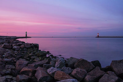 Scenic view of sea against sky at sunset