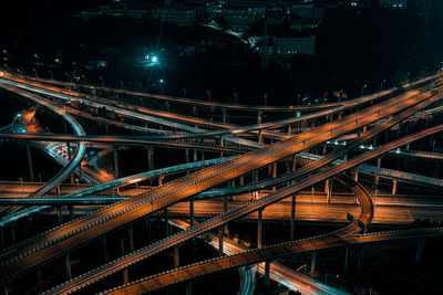 High angle view of illuminated bridge at night