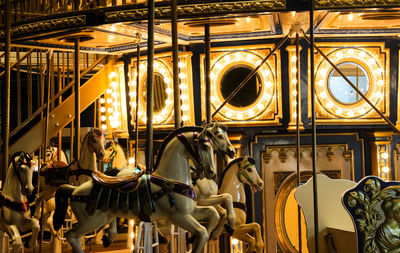 Carousel in amusement park at night