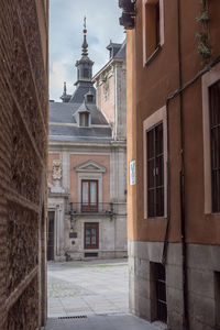 Alley amidst buildings in city