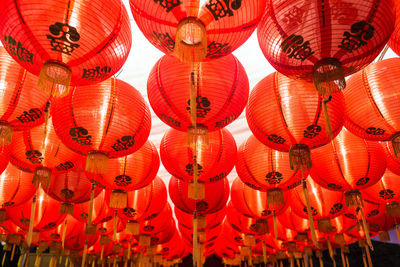 Low angle view of lanterns hanging in traditional building