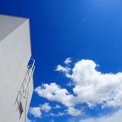 Low angle view of building against blue sky