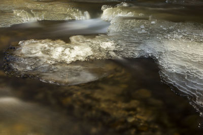 High angle view of water flowing in sea