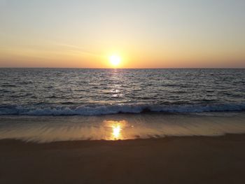 Scenic view of sea against clear sky during sunset