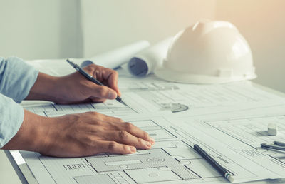 Close-up of man working on table