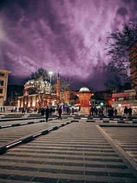 Illuminated buildings in city at night